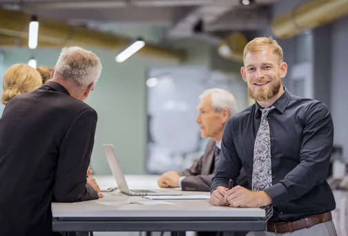 Payspot worker helping a customer